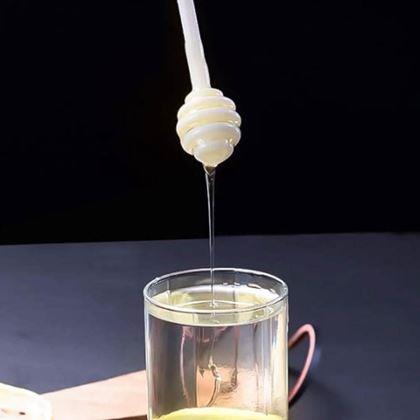 Imaginea din Borcan de sticla cu lingura de miere