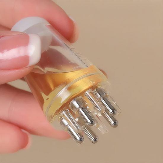 Imaginea din Aplicator de masaj pentru uleiul de păr