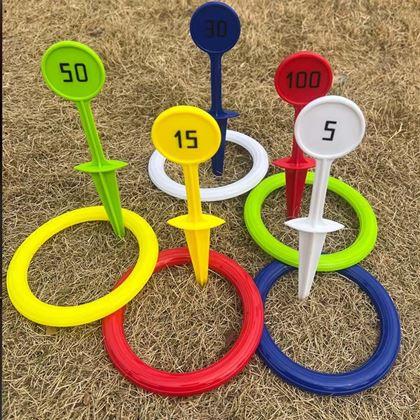 Imaginea din Joc de aruncat inele cu țăruși de fixat în pământ